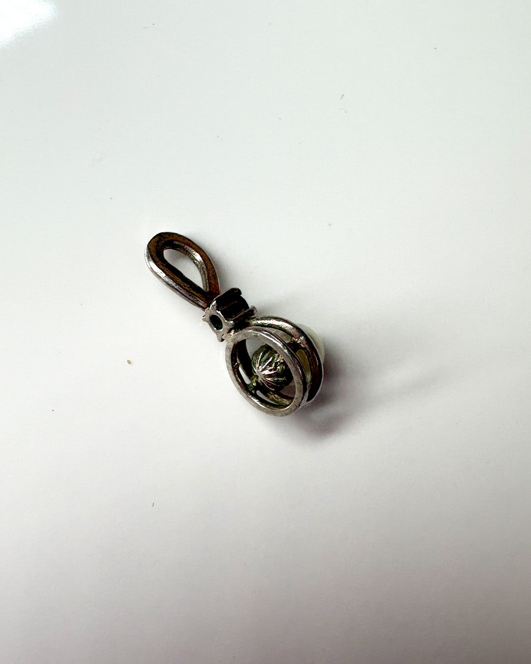 hold my pearl and dark blue stone charm