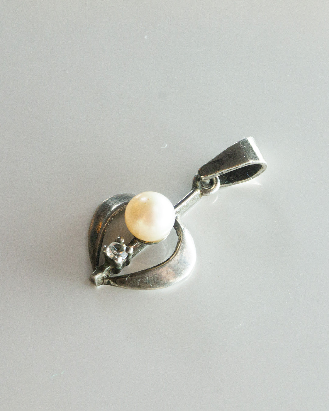 pearl jammed heart charm