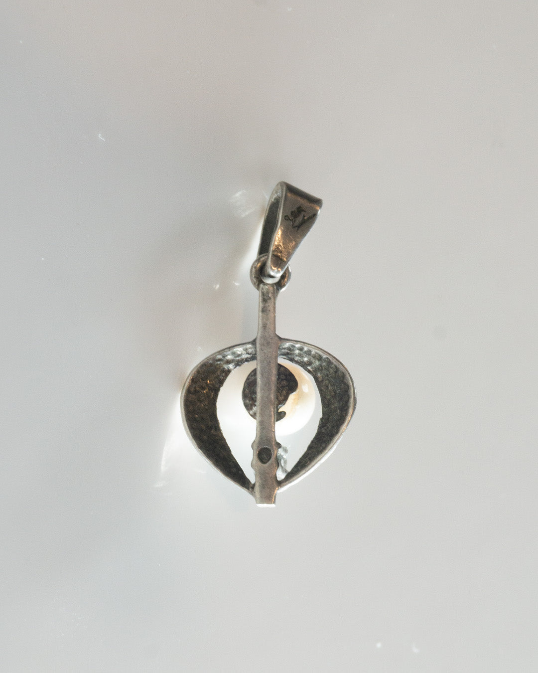 pearl jammed heart charm