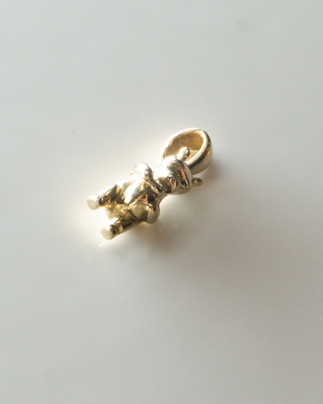 winnie the poo gold charm