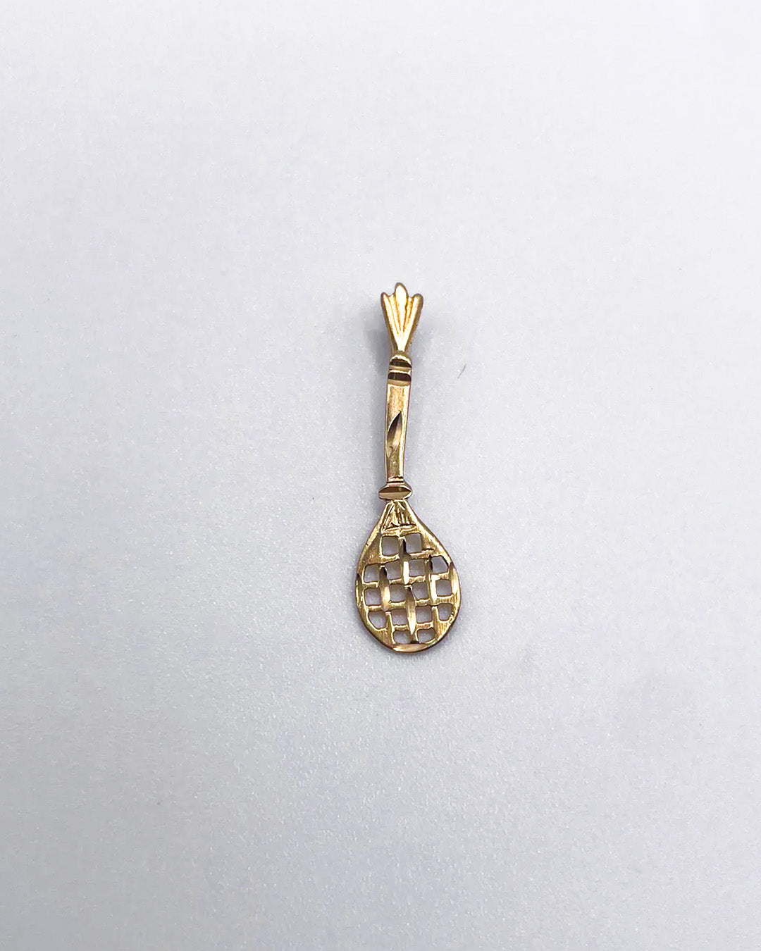 golden racket charm