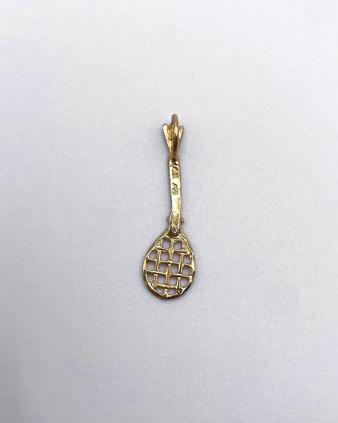 golden racket charm