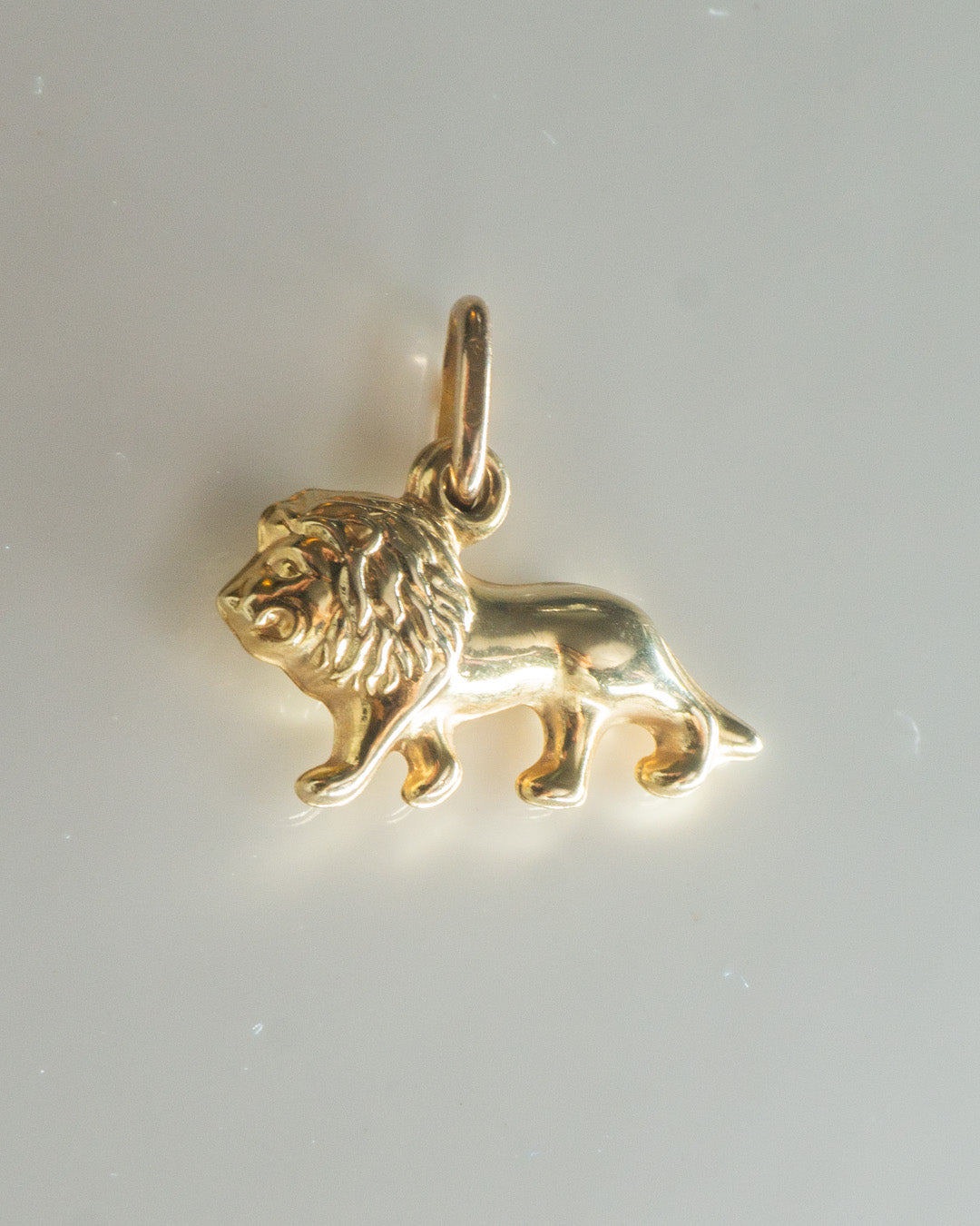lion king gold charm