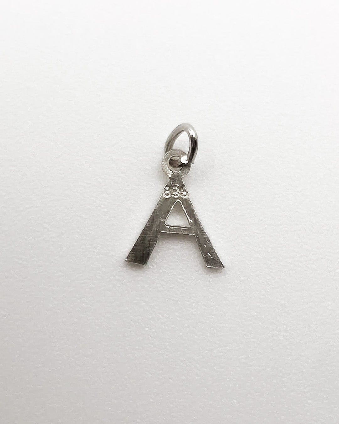 tiny A charm